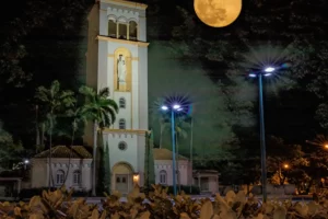 A church with a moon in the background