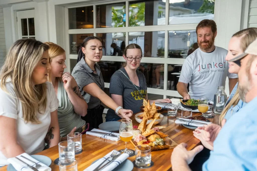 A group being served food at a table