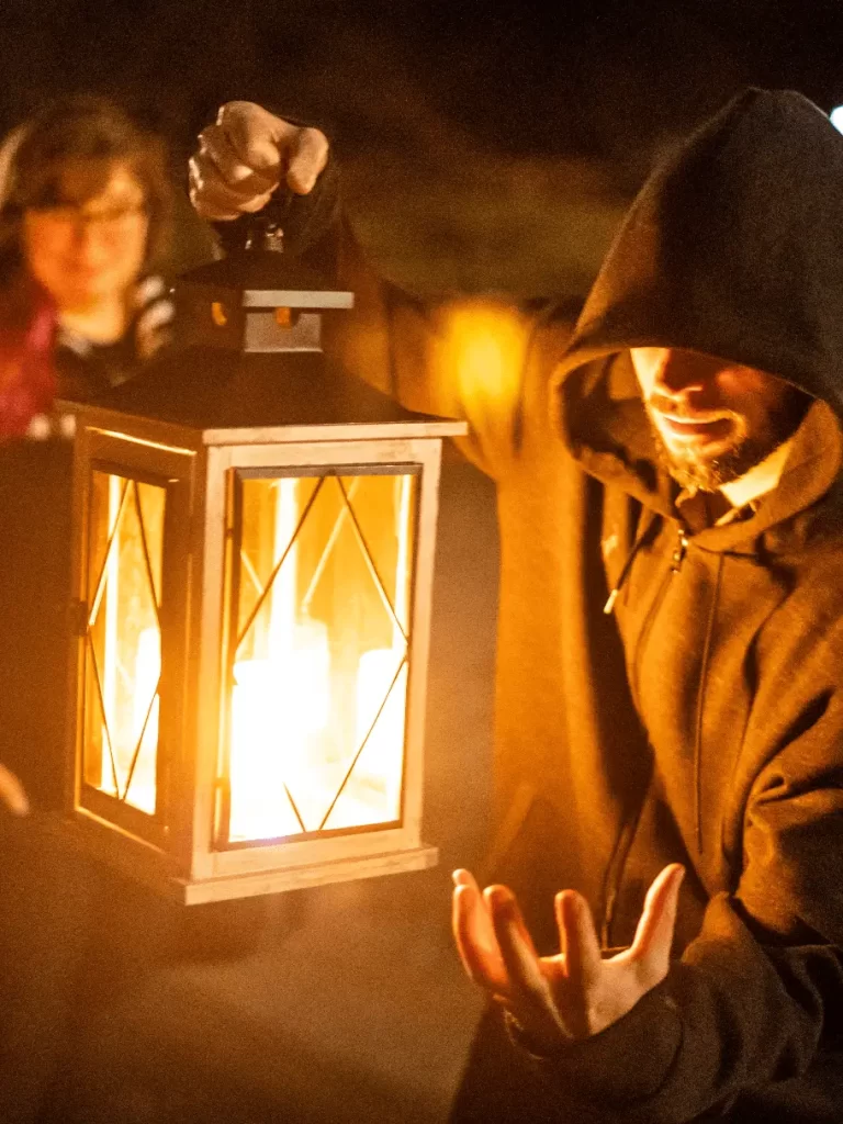 Tour guides narrating spooky tales to their guests