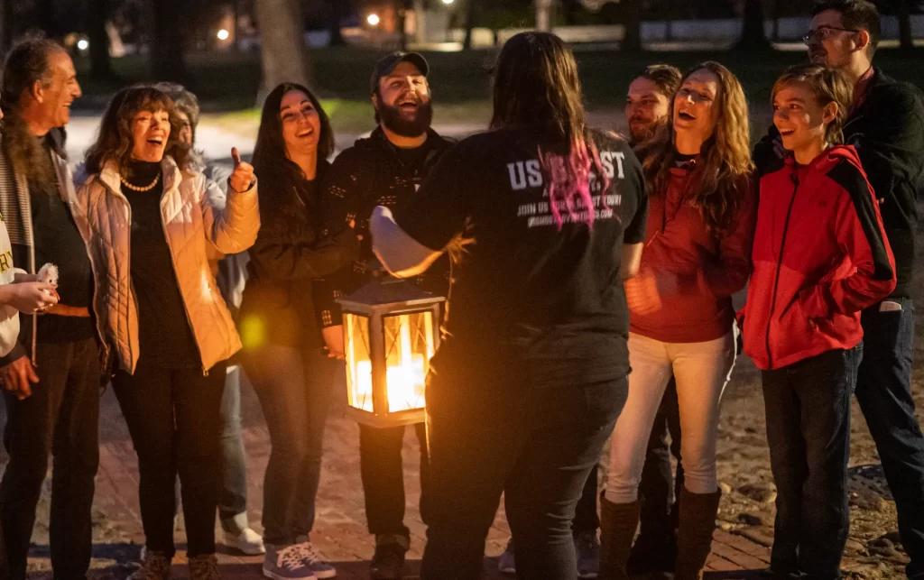A guide telling a ghost story on the Savannah Ghost Tour