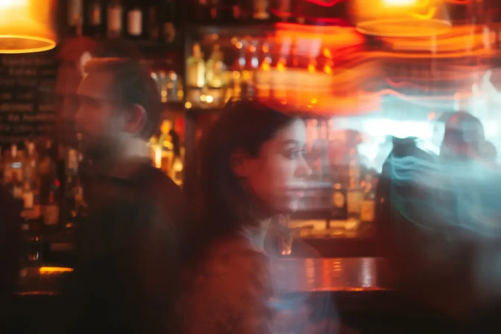 Ghostly figures in a bar