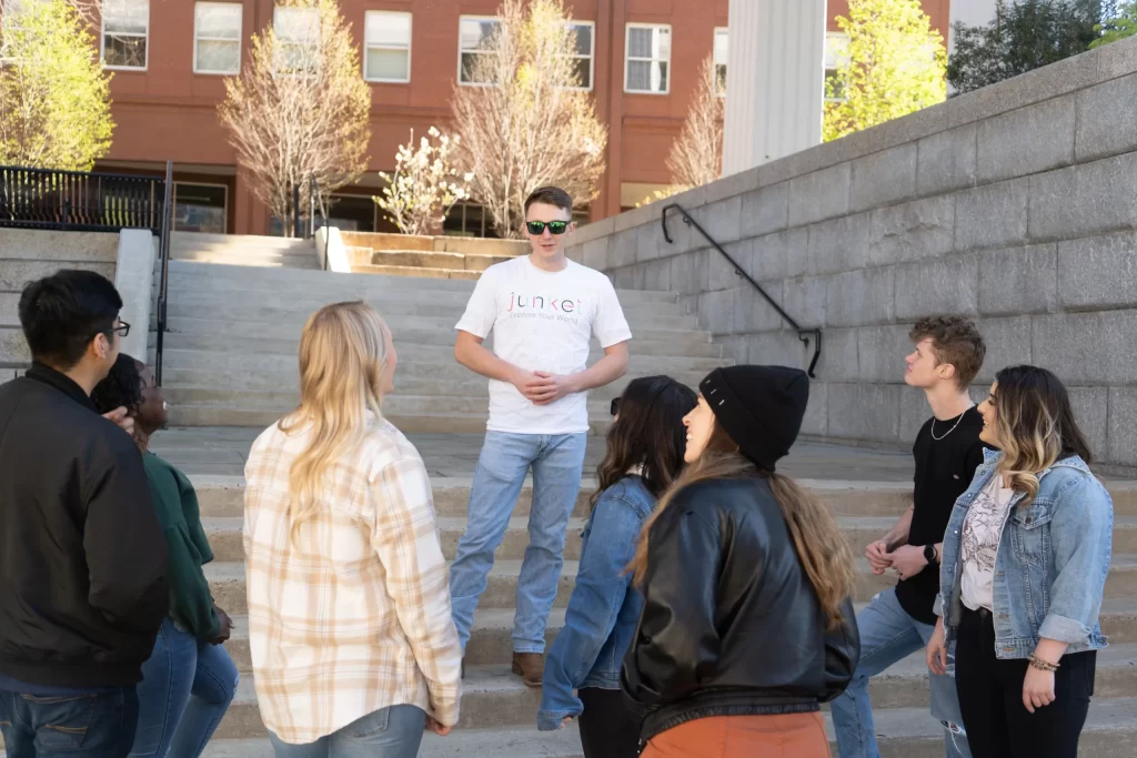 A tour guide sharing a story on the stairs