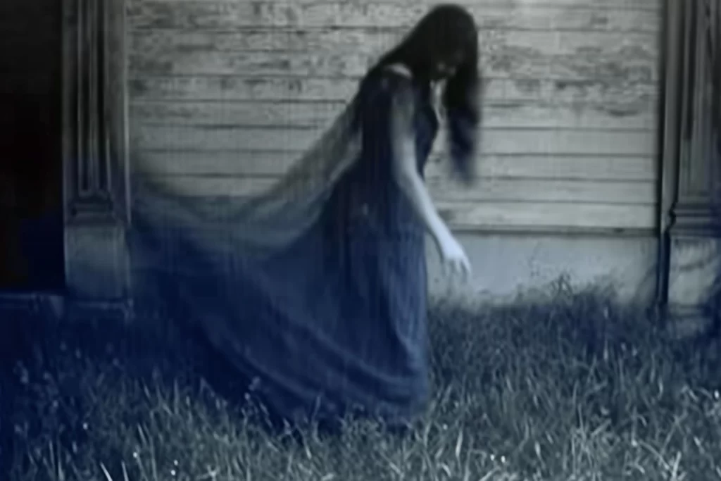 A ghostly woman in blue