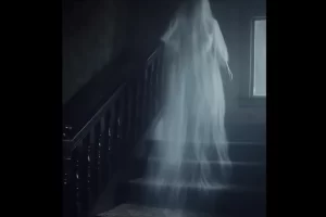 Ghost on stairs: haunting presence in dim, creaky steps