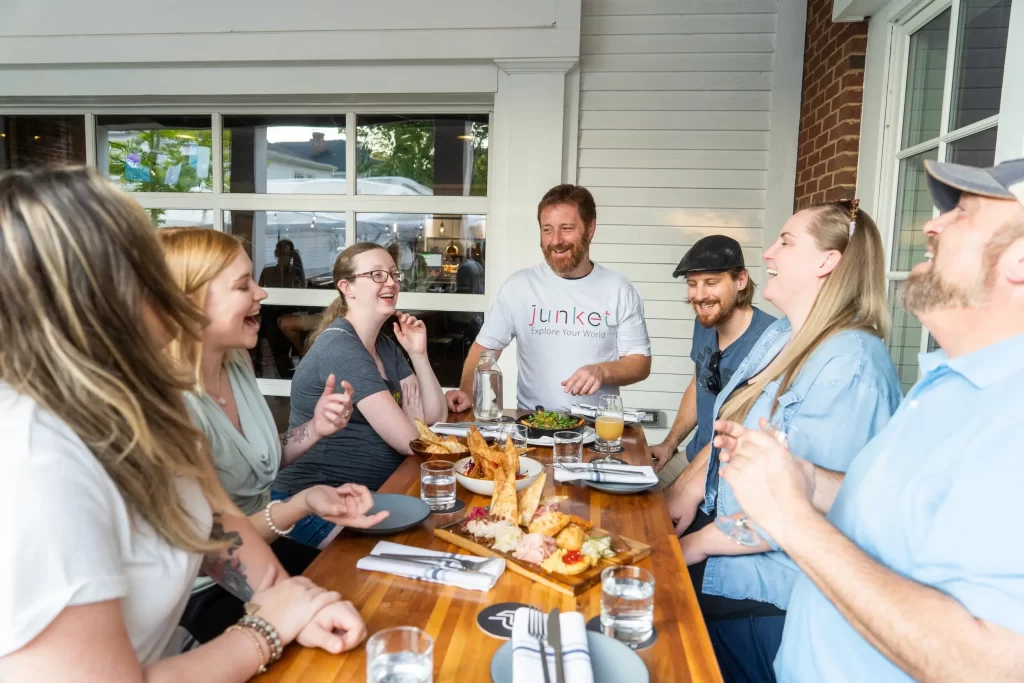 A group at a table enjoying food during a Gettysburg food tour