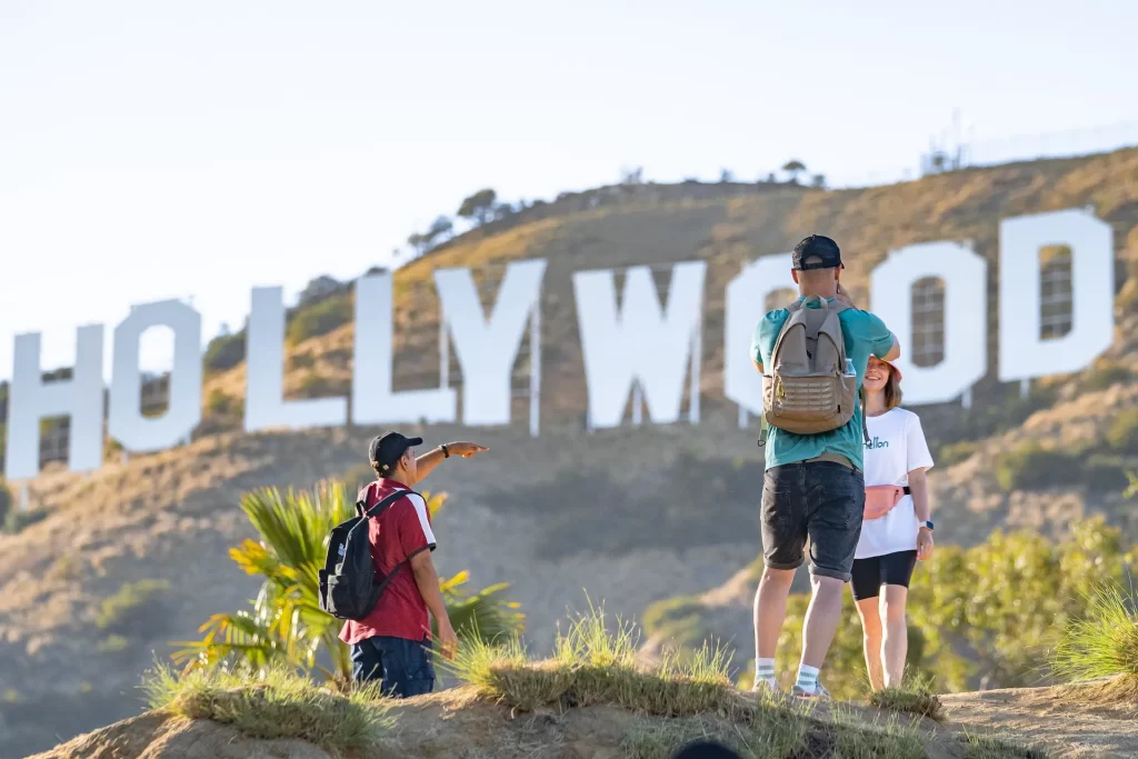 People Facing Hollywood Sign